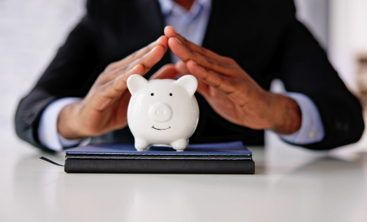 hands over piggy bank